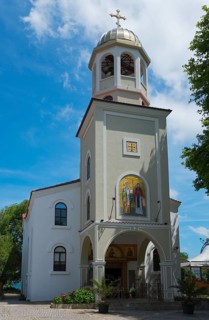 Orthodox church with bell tower under a clear blue sky