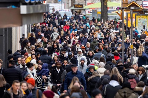 Crowded shopping street in front of Christmas