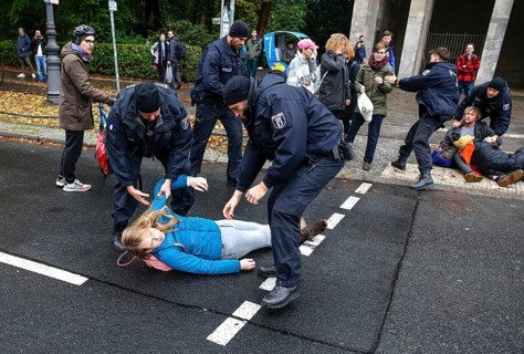 Police officers carry last generation climate activists from Strasse des 17. The Last Generation has called for a mass occupation action