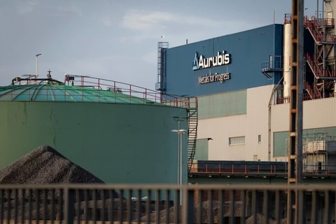 Logo and lettering Aurubis Metal for Progress on a factory building at the Aurubis AG plant