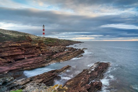 Tarbat Ness lighthouse on rocky cliffs