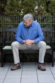 Man with grey hair and a full beard
