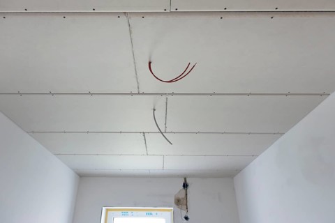 Plasterboard panels under the ceiling