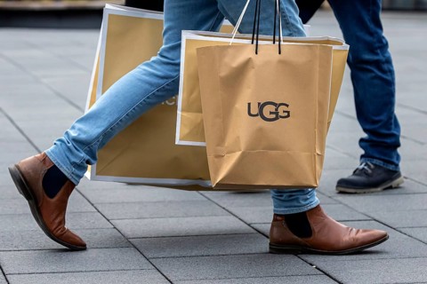 Consumer tourist lugging shopping bags