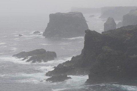 Sea stacks and cliffs in the mist at Eshaness