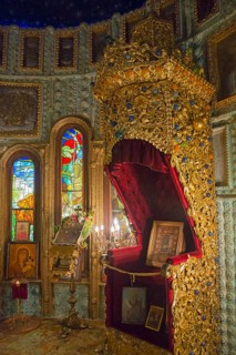 A richly decorated iconostasis with paintings and gold ornaments in a church