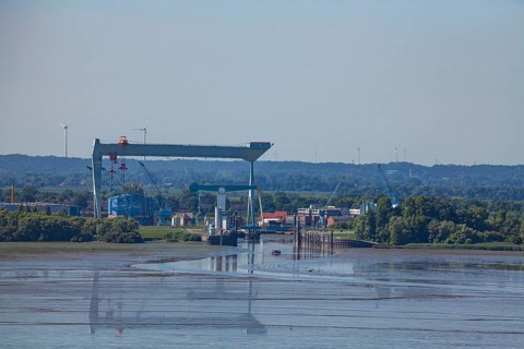 Shipyard crane Jucho and bridge at the mouth of the river Este into the Elbe