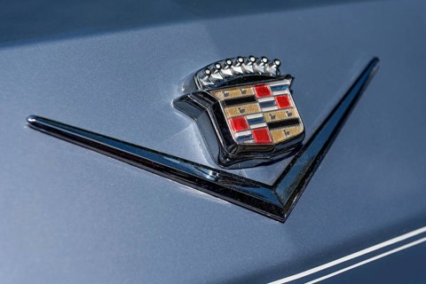 Logo Cadillac on vintage car Coupe DeVille at the rear