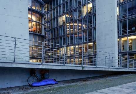 A homeless man sleeps in a sleeping bag at the Paul Loebe Haus. Aid organisations register an increase in homeless people