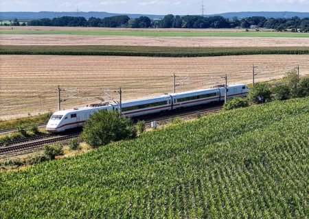 An ICE with two wagons on the open track