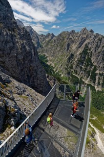 People on a viewing platform in the mountains
