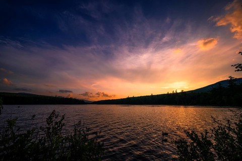 Summer Solstice Sunset on a lake in Catskills Mountains