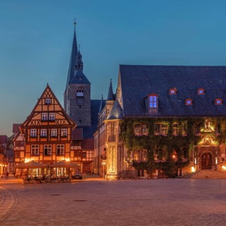 Cafe on the market square with St Benedikti church and town hall