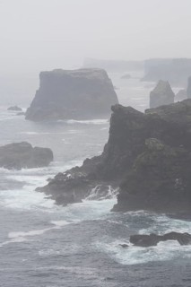 Sea stacks and cliffs in the mist at Eshaness