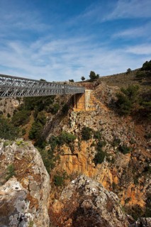 An iron bridge spans a gorge under a blue sky, Aradena Gorge, Aradena, Sfakia, Crete, Greece,