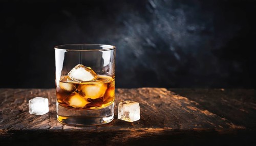 Whiskey with rocks or ice cubes in a glass with ice in a dark wooden background. AI Generated, AI