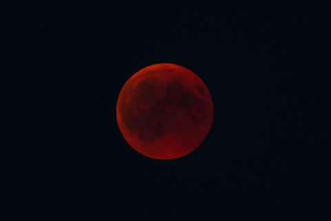 Intense red blood moon in the night sky, mystical atmosphere, Haan, North Rhine-Westphalia,
