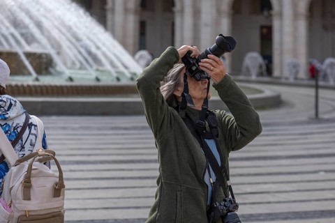 Photographer taking pictures in the Piazza de Ferrari, Genoa, Italy, Europe