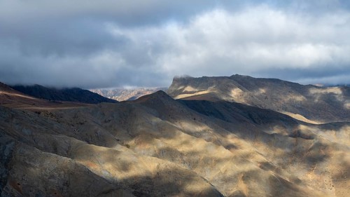 Low hanging clouds in the mountain landscape at the Tizi-n-Tichka pass road, High Atlas, Morocco,