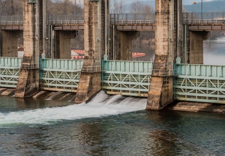River dam in South Korea with water flowing through one of the flood gates