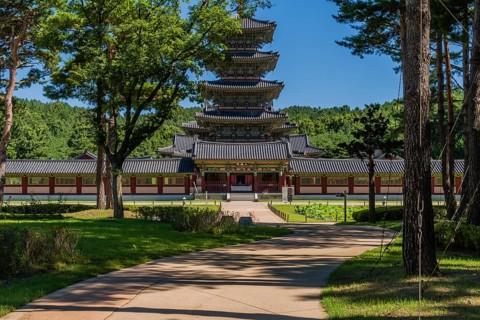 Buyeo, South Korea, July 7, 2018: Sidewalk leading to main gate of Neungsa Baekje Temple with five