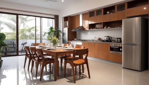 A sleek modern kitchen with a dining table set for a meal, illuminated by natural and pendant
