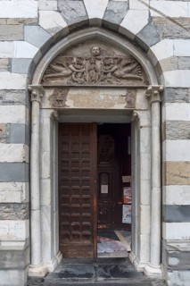 Side portal of the Romanesque Chiesa Parrocchia Abbazia di San Stefano, mentioned in 920, Piazza
