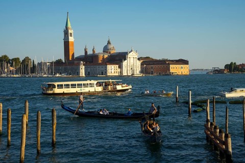 Gondolas on the promenade of the Riva degli Schiavon with a view of San Giorgia Maggiore, Venice,