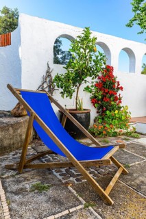 Blue deckchair on a terrace, Capoliveri, Elba, Tuscan Archipelago, Tuscany, Italy, Europe