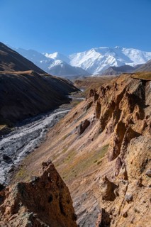 Valley with river Achik Tash between high mountains, mountain landscape with peak Pik Lenin, Osh
