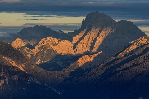 View over a valley to rugged mountains in the evening light, clouds, view from the Wank to the