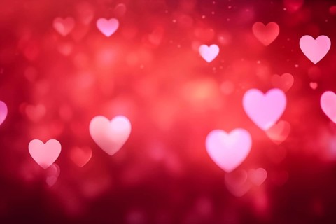 A romantic and dreamy background featuring heart-shaped bokeh lights, perfect for Valentine Day or