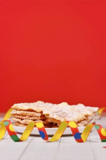 Fried Italian dessert snack for carnival season called 'Galani', ' Chiacchiere' or 'Crostoli' in