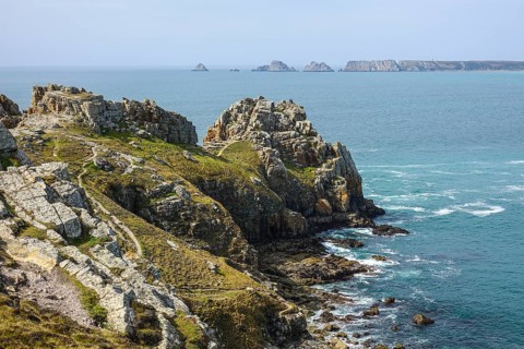 Pointe de Dinan, Crozon, behind Pointe de Pen Hir with the rocks Les Tas de Pois, Crozon peninsula,