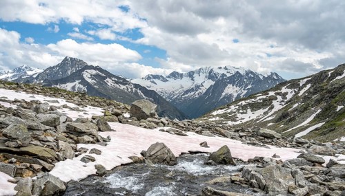 Mountain stream Lapenkarbach on the Berliner Hoehenweg, mountain panorama with glaciated mountain
