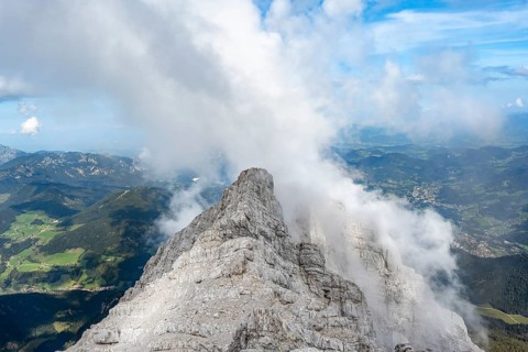 Rocky narrow mountain ridge with summit Watzmann Hocheck, view from Watzmann middle summit to