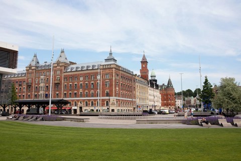 Angfaerjepark on the quay promenades, behind a traditional house and the town hall, Helsingborg,