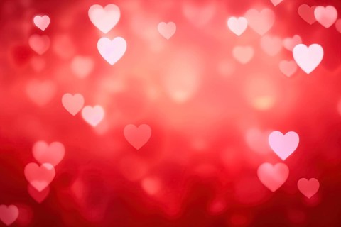 A romantic and dreamy background featuring heart-shaped bokeh lights, perfect for Valentine Day or