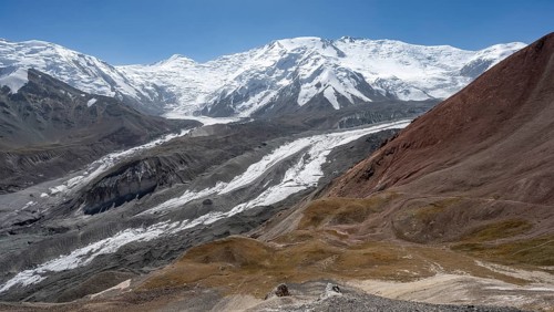 High mountain landscape with glacier moraines and glacier tongues, glaciated and snow-covered