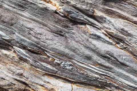 Coloured, ferrous mineral rocks on the beach of Topinetti, near Rio Marina, Elba, Tuscan
