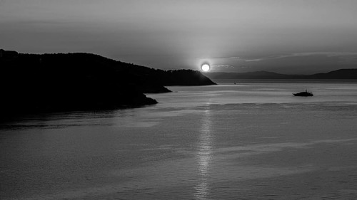 Sunrise in the Baia di Mola bay off Porto Azzurro, black and white photo, Elba, Tuscan Archipelago,