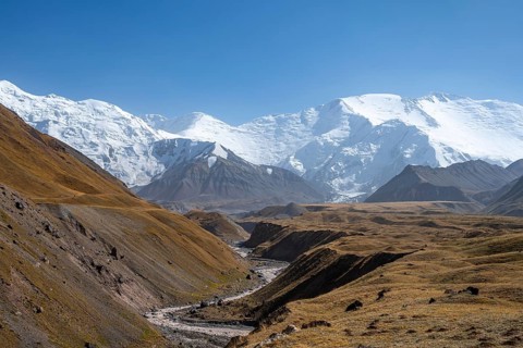 Valley with river Achik Tash between high mountains, mountain landscape with peak Pik Lenin, Osh