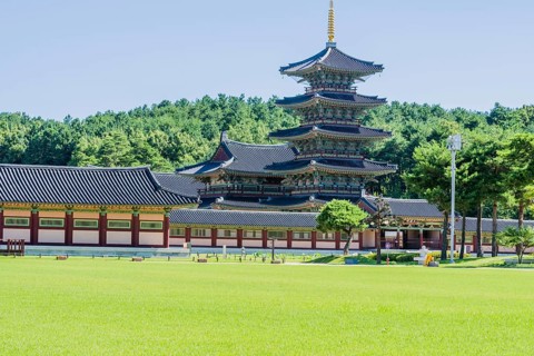 Buyeo, South Korea, July 7, 2018: Main gate of Neungsa Baekje Temple with golden spire on top of