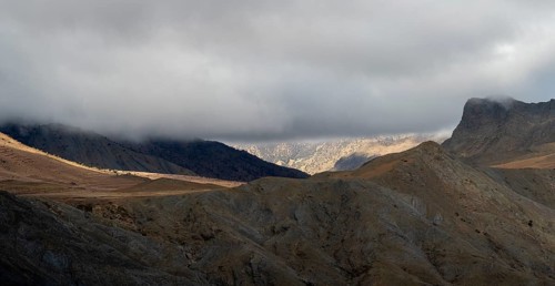 Low hanging clouds in the mountain landscape at the Tizi-n-Tichka pass road, High Atlas, Morocco,