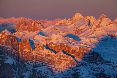 View of high plateau and mountains in the snow at sunset, winter, view of Geisler peaks, Dolomites,