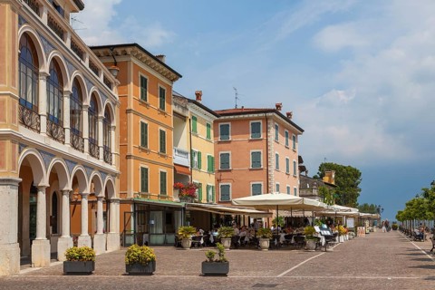 Waterfront promenade with restaurants in Gargnano, Lake Garda, Province of Brescia, Lombardy,