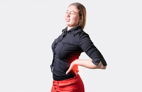 People with spine problems isolated. Suffering girl with back pain. Young woman with back pain.