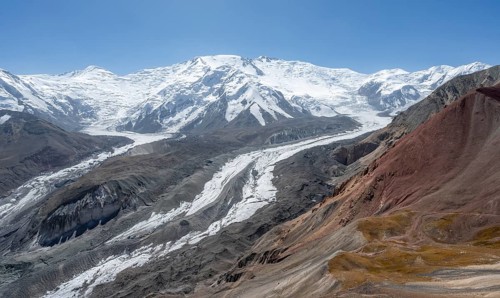 High mountain landscape with glacier moraines and glacier tongues, glaciated and snow-covered