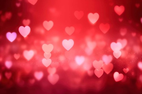 A romantic and dreamy background featuring heart-shaped bokeh lights, perfect for Valentine s Day