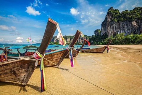 Long tail boats on tropical beach Railay beach in Thailand